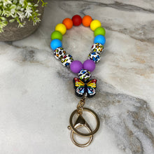 Load image into Gallery viewer, Silicone Bracelet Keychain - Rainbow Butterfly
